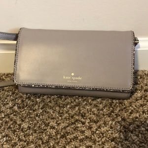 Grey kate spade crossbody with glitter outline